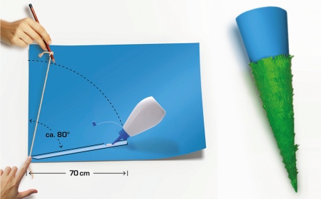 zwei Hände, die auf blauem Tonpapier mit Hilfe eines Schnurzirkels eine Kreislinie ziehen, Klebstoff & Schultüte zwei Hände, die auf blauem Tonpapier mit Hilfe eines Schnurzirkels eine Kreislinie ziehen, Klebstoff & Schultüte
