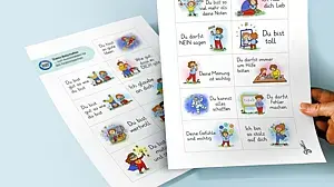 Bild von zwei Papierbögen mit illustrierten starken Botschaften für Kinder.