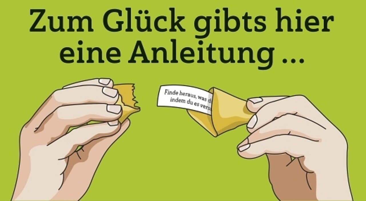 Zwei Hände öffnen einen Glückskeks