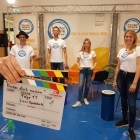 Kinder stark machen Team, davor eine Filmklappe